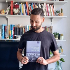 Ilias Alami with book